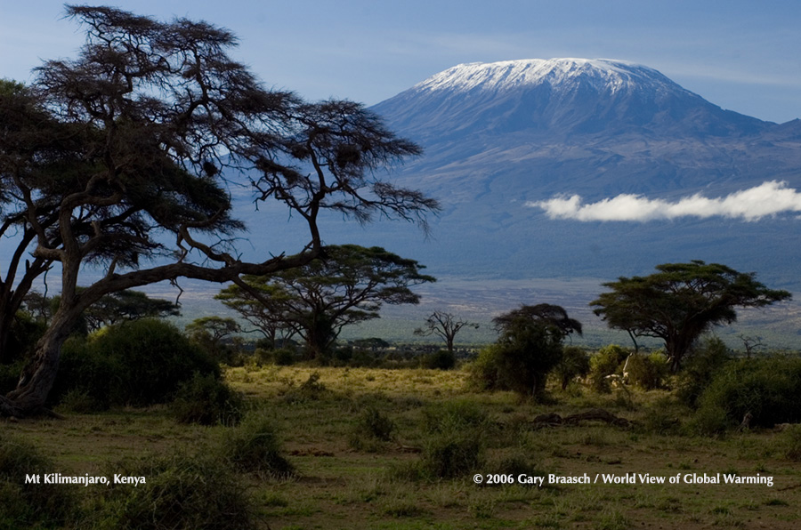 Mt Kilimanjaro from Amboseli Natl Park, Kenya, light dusting of snow does not obscure the narrow shards of glacier remaining on NE rim of summit.