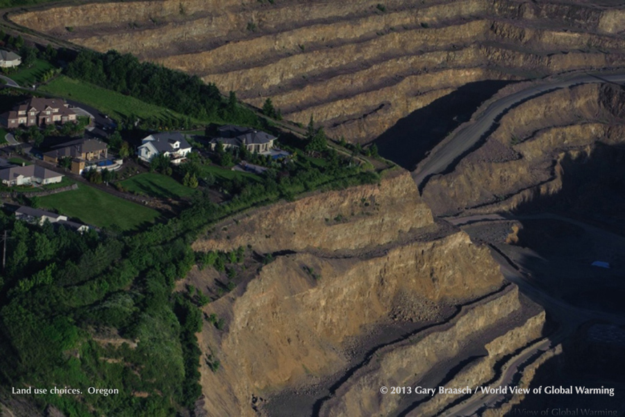 Expensive suburban homes cling to clifftop surrounded by Baker Rock Resources quarry, Beaverton Or -- symbolic of our landuse choices.