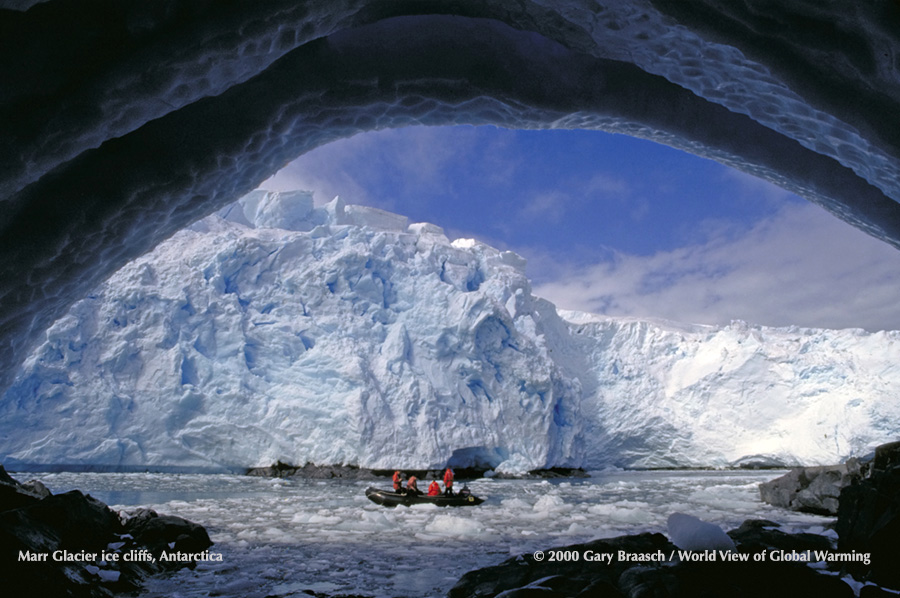 Zodiac carrying scientists from US Palmer Station Base explore the receding edge of Marr Ice Piedmont, Anvers Is Antarctica. 