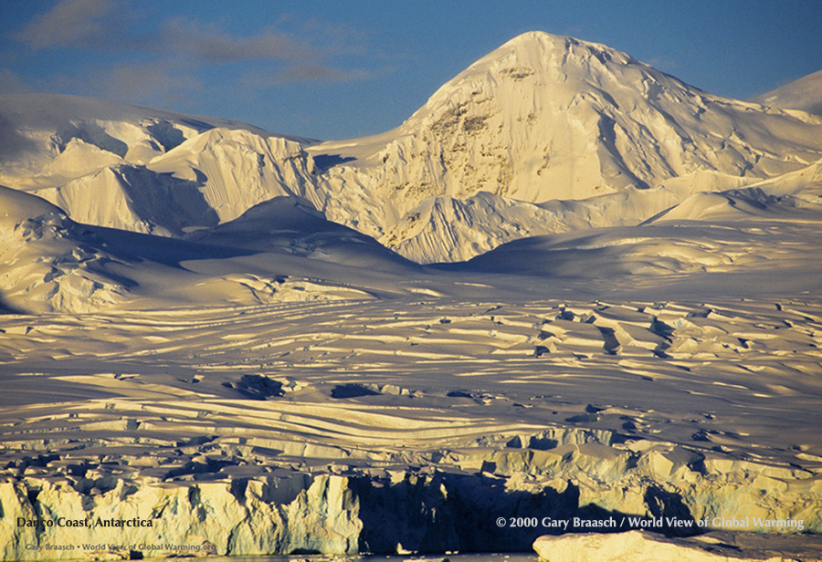 Disco coast of Antarctic Peninsula in low light, April 1999, showing crevasses and calving front of faster moving, thinning glacier.