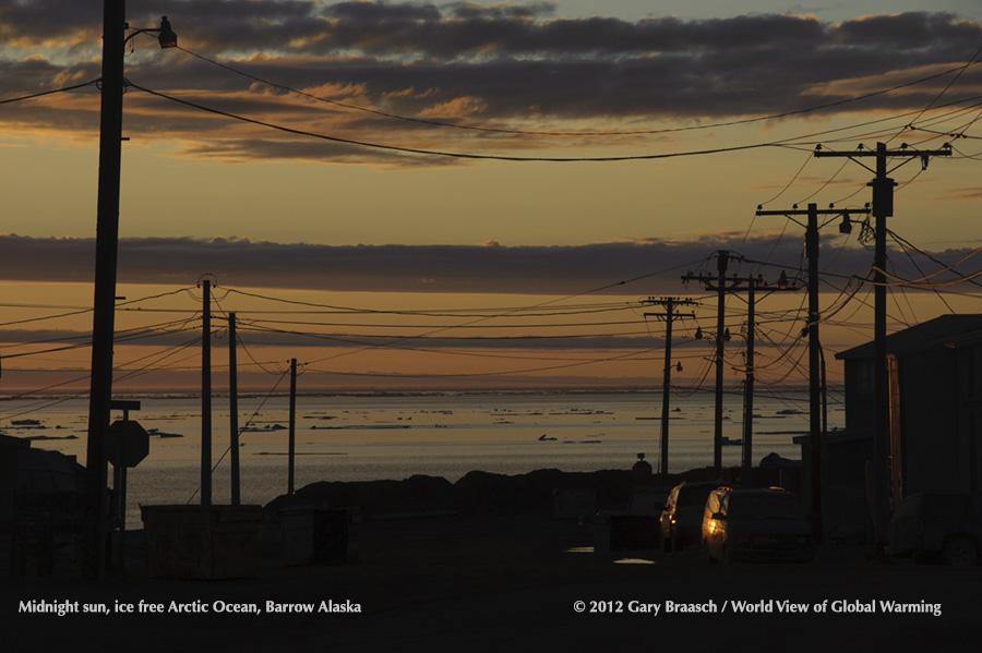 Barrow, Alaska, midnight sun view down street to nearly ice free Arctic Ocean, early Aug 2012, when sea ice reached record low. 