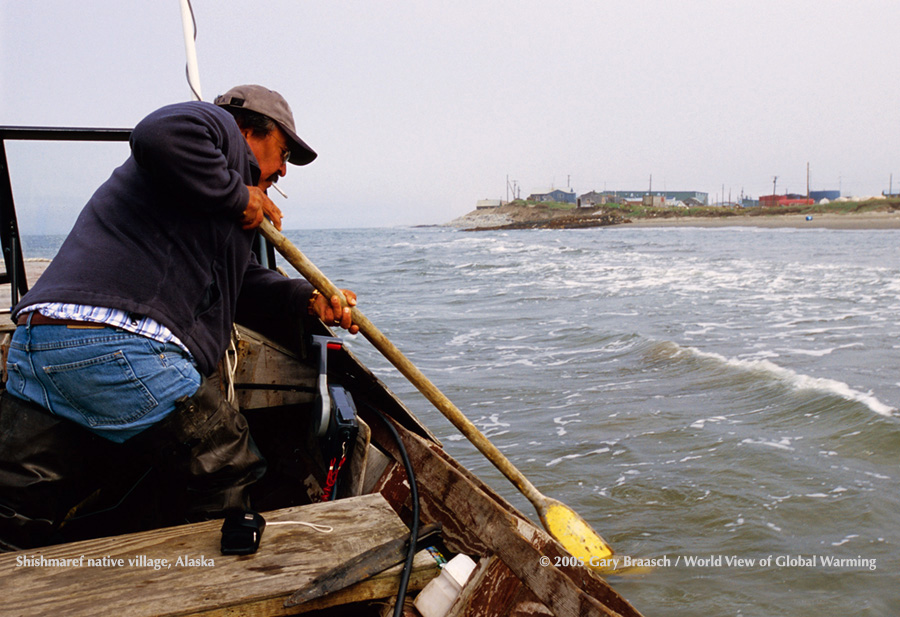 Tony Weyiouanna Sr. in his boat out where his village of Shishmaref Alaska was in his youth. Erosion is up to 60 feet a year.