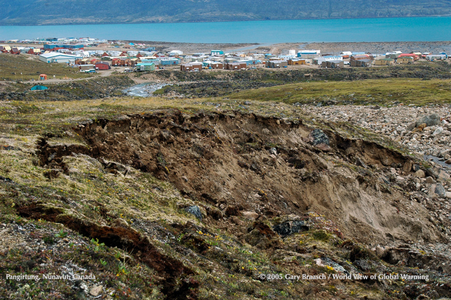 Just above Pangnirtung, Nunavut, Canada, erosion from melting ice and thermokarsting of permafrost is starting to erode a hillside. Baffin Island.