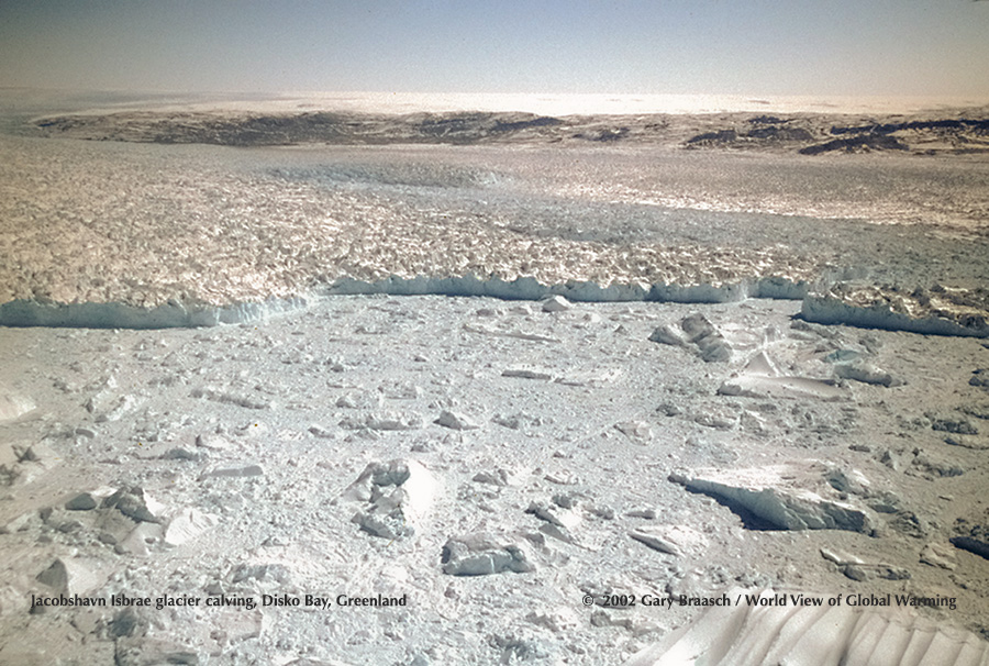 Huge icebergs calve from Jacobshavn Isbrae (Glacier) West Greenland. This glacier is accelerating, now flowing more than 7 miles each year. See Glaciers.