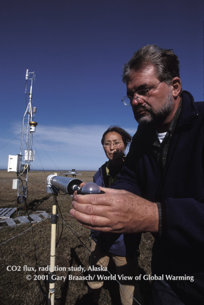 Walt Oechel and colleague work at a carbon flux measurement site in Barrow, Alaska, to help determine if tundra is a sink or source of greenhouse gasses..