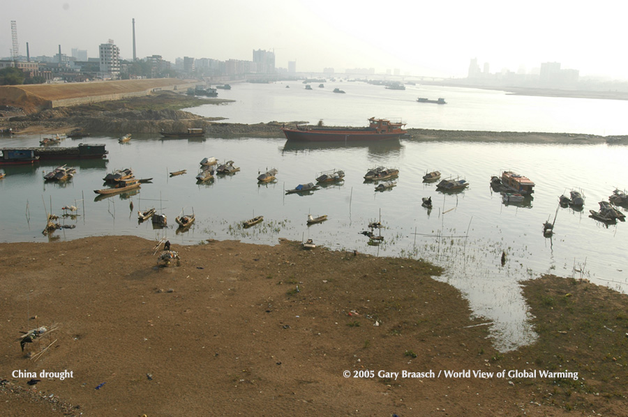 During severe drought, 2005, in Guangdong Province,China, the shrinking North River strands many boats.