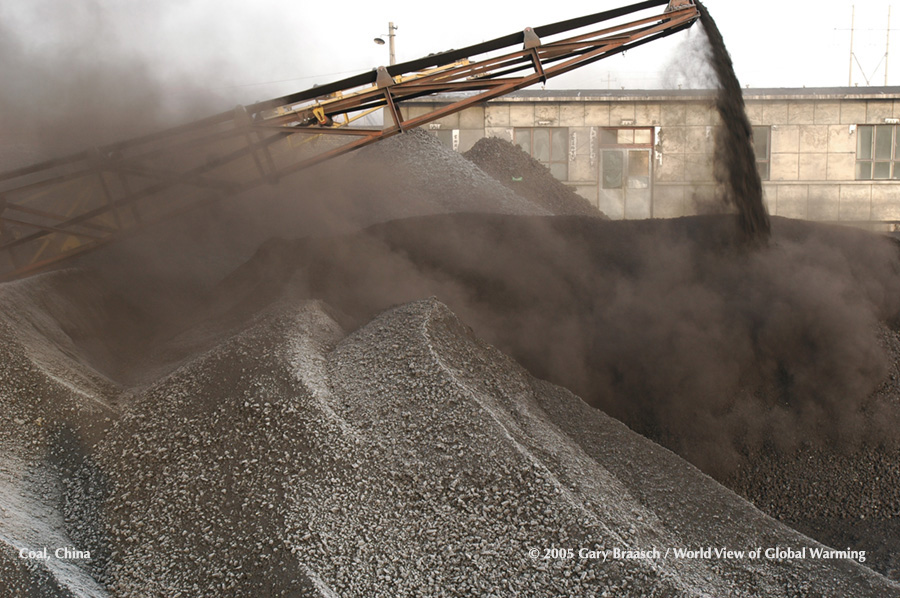 Coal being piled at yard near Baotou, Inner Mongolia, China, where nearby coal mines serve giant powerplants.