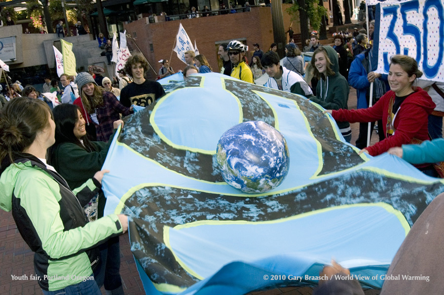 350.org demonstrators bounce the planet on their 350 sheet in Pioneer Courthouse Square, Portland OR at youth climate rally.