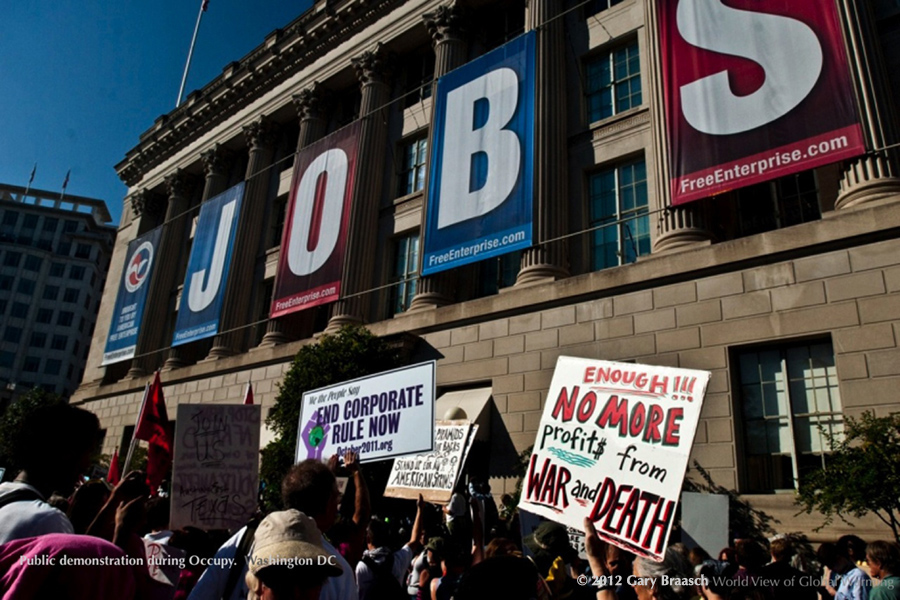 Duelling signs in Washington DC: Chamber of Commerce JOBS vs Occupy protestors of corporate rule.