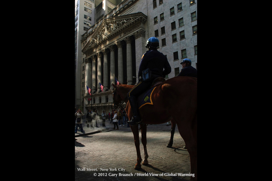 Wall Street, New York City, guarded by mounted police during Occupy.