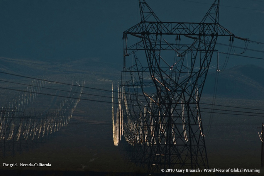 Multiple lines of large high tension powerlines from Hoover Dam cross the desert from Nevade into California..