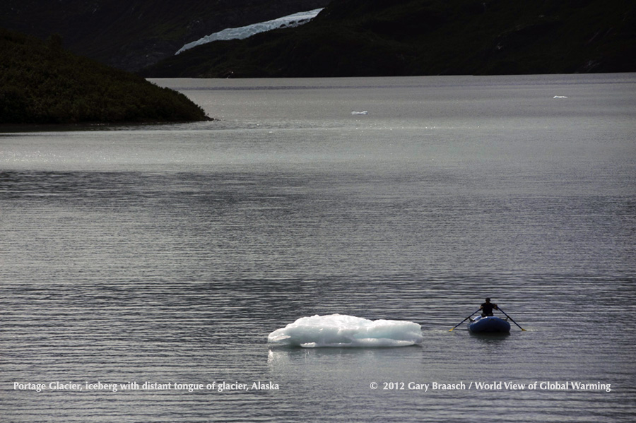 Alaska Portage Lake with only tiny part of glacier showing beyond a single iceberg. View from road to Whittier.