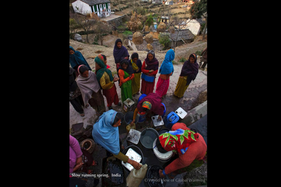 Women of Chausali, Uttarakhand, India must wait hours to fill containers from a spring running more slowing as climate changes.