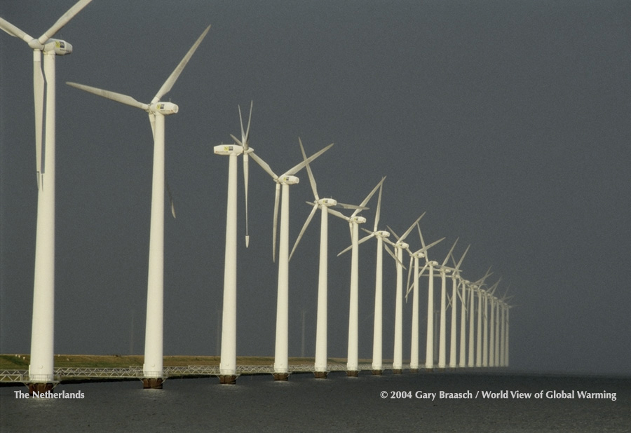 Wind turbines along the dike at Flevoland, Netherlands, which is both preparing for rising sea levels and moving toward renewable energy.