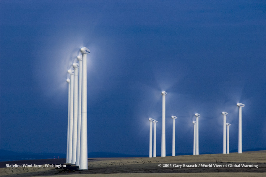 Dusk shot of rotating Vestas turbines in Stateline wind farm, Washington, on Columbia River.